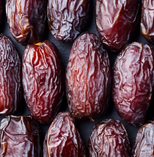 Fresh Medjool Dates background. Healthy organic product. Top view. Close up.