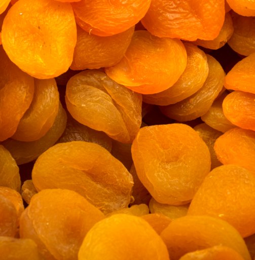 Dried apricot fruit forming a background